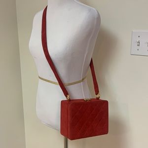 CHANEL quilted red suede box style handbag.  Gold hardware. CC logo on bottom